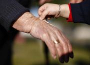 child-plays-wih-wrinkles-on-the-hand-of-great-grandmother
